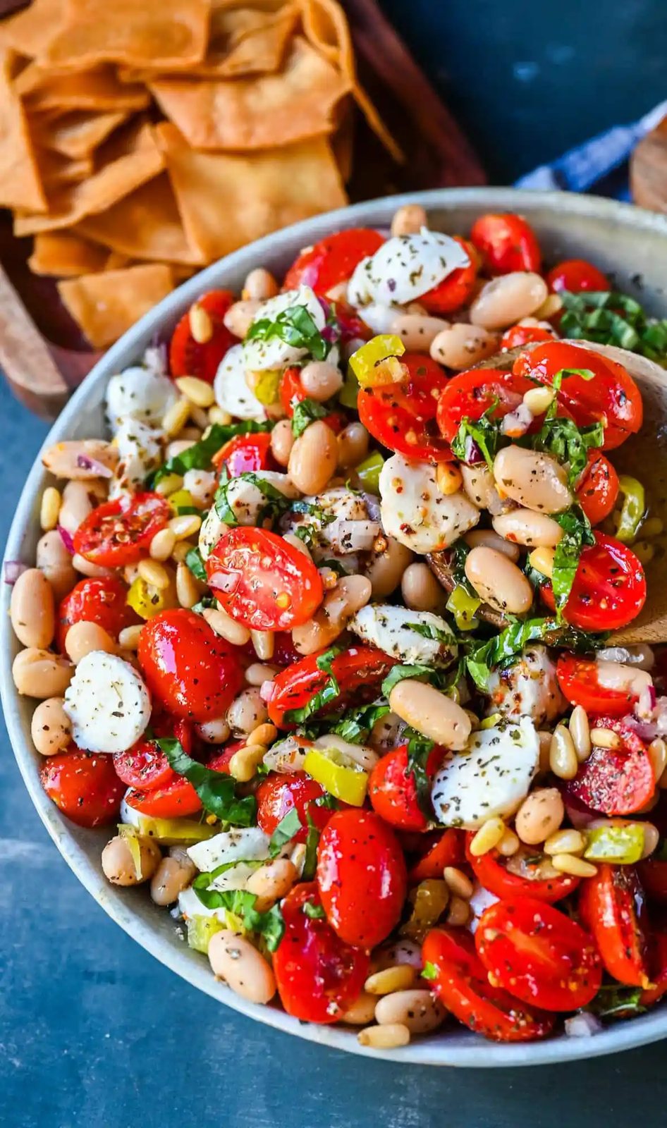 This Italian Cowboy Caviar is a fresh, flavorful twist on the viral cowboy caviar made with juicy tomatoes, creamy mozzarella pearls, tender white beans, pepperoncinis, and basil for a Mediterranean-inspired dip. This easy Italian appetizer comes together in minutes and is perfect for holiday parties, snacking, or meal prep.