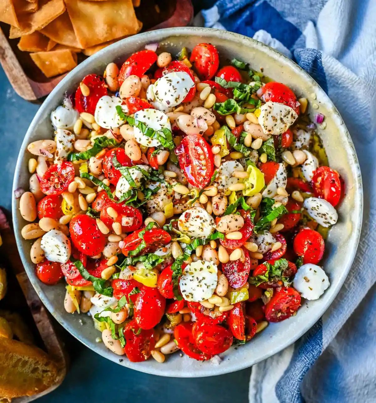 This Italian Cowboy Caviar is a fresh, flavorful twist on the viral cowboy caviar made with juicy tomatoes, creamy mozzarella pearls, tender white beans, pepperoncinis, and basil for a Mediterranean-inspired dip. This easy Italian appetizer comes together in minutes and is perfect for holiday parties, snacking, or meal prep.