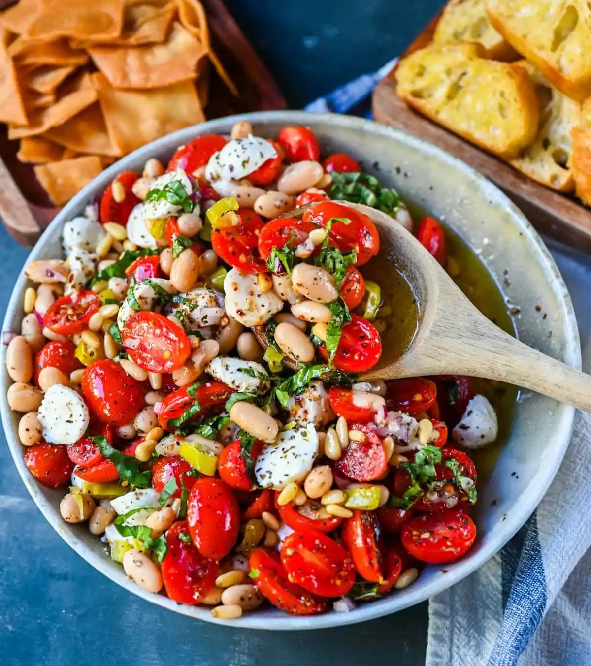 This Italian Cowboy Caviar is a fresh, flavorful twist on the viral cowboy caviar made with juicy tomatoes, creamy mozzarella pearls, tender white beans, pepperoncinis, and basil for a Mediterranean-inspired dip. This easy Italian appetizer comes together in minutes and is perfect for holiday parties, snacking, or meal prep.