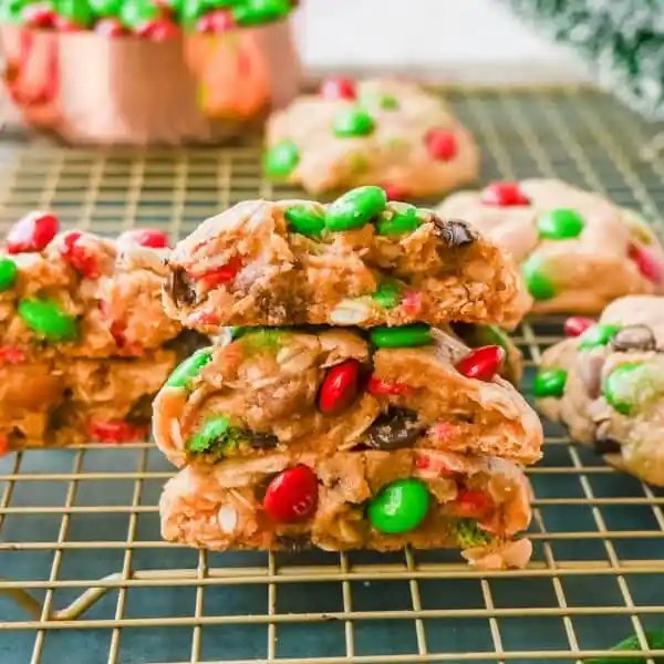 Christmas M & M Cookies. These popular, soft, thick, and chewy Christmas Monster Cookies are made with oats, peanut butter, chocolate chips, and holiday red and green M & M's. They are an easy Christmas cookie that can be made in minutes.