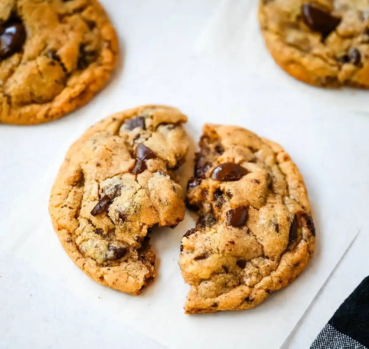 These famous Jacques Torres chocolate chip cookies are soft and chewy, and loaded with bittersweet chocolate discs. With golden edges, a soft center, and a sprinkle of sea salt on top, they’re the ultimate bakery-style chocolate chip cookies you can make at home. These are the New York Times top rated #1 chocolate chip cookie recipe.