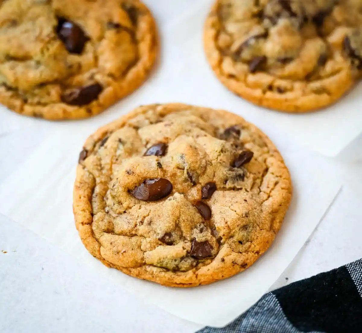 These famous Jacques Torres chocolate chip cookies are soft and chewy, and loaded with bittersweet chocolate discs. With golden edges, a soft center, and a sprinkle of sea salt on top, they’re the ultimate bakery-style chocolate chip cookies you can make at home. These are the New York Times top rated #1 chocolate chip cookie recipe.