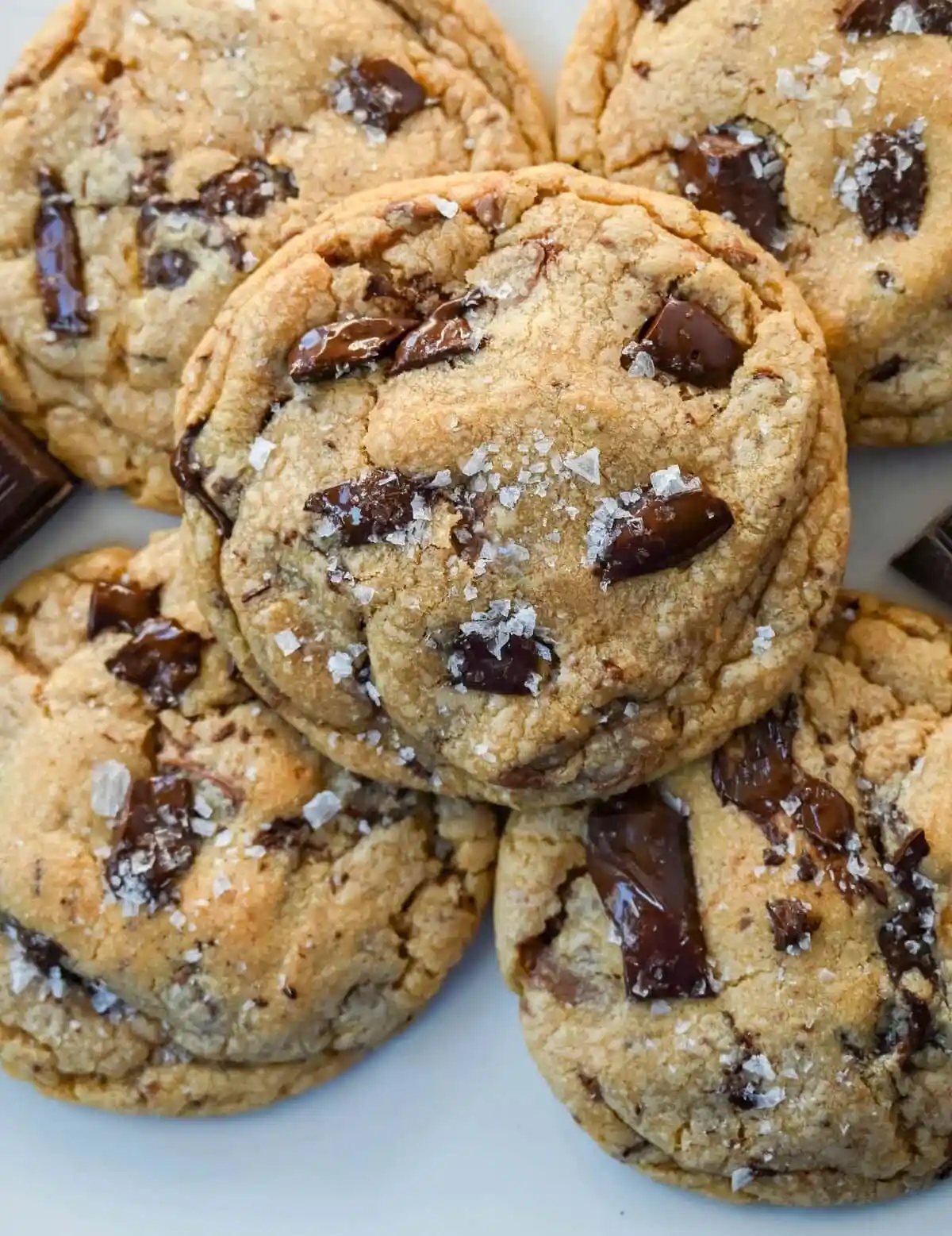 These famous Jacques Torres chocolate chip cookies are soft and chewy, and loaded with bittersweet chocolate discs. With golden edges, a soft center, and a sprinkle of sea salt on top, they’re the ultimate bakery-style chocolate chip cookies you can make at home. These are the New York Times top rated #1 chocolate chip cookie recipe.