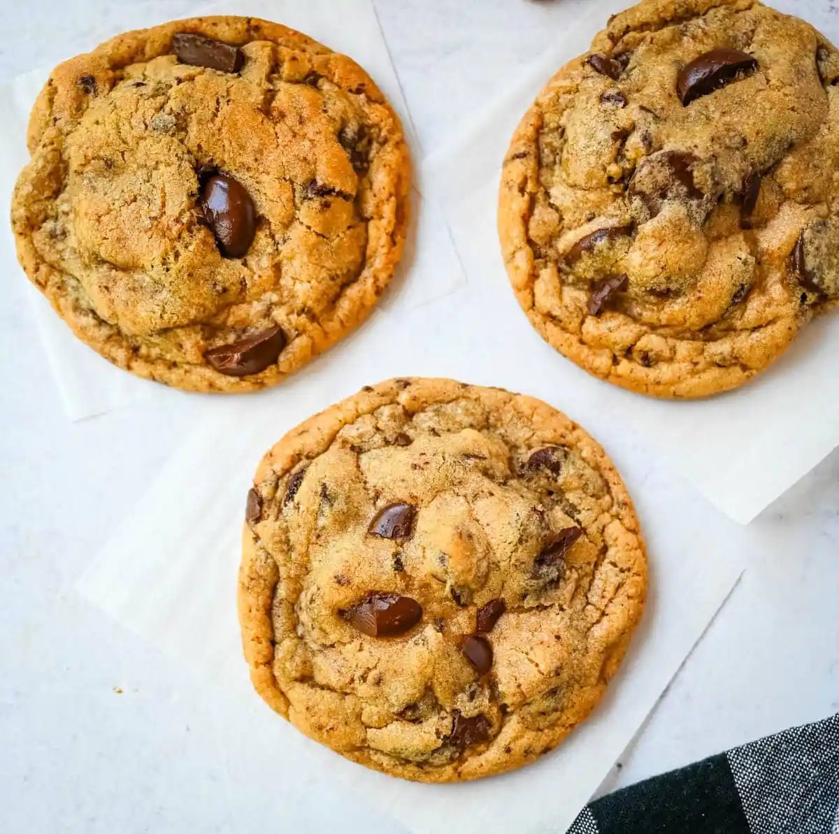 These famous Jacques Torres chocolate chip cookies are soft and chewy, and loaded with bittersweet chocolate discs. With golden edges, a soft center, and a sprinkle of sea salt on top, they’re the ultimate bakery-style chocolate chip cookies you can make at home. These are the New York Times top rated #1 chocolate chip cookie recipe.
