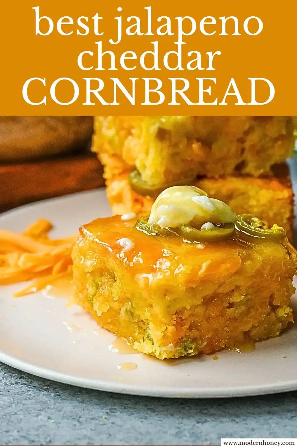 This Homemade Jalapeno Cheddar Cornbread is golden, cheesy, spicy, and just a little sweet, and is the ultimate upgrade from basic boxed cornbread. It has a moist, fluffy center amd layered with sharp cheddar cheese and jalapenos for the perfect Jalapeno Cheddar Cornbread recipe.