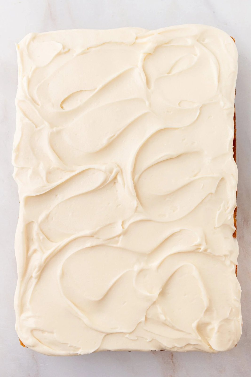 Banana Cake in 9x13 pan with cream cheese frosting.