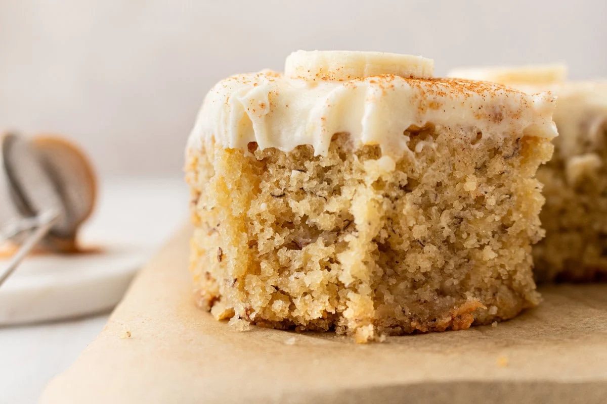 Jeff's BEST Banana Cake Recipe is a moist and tender banana cake with a creamy, sweet, and buttery cream cheese frosting. Some say it is the best banana cake in the world! This moist banana cake with cream cheese frosting is baked in a 9×13 pan and is always a hit!