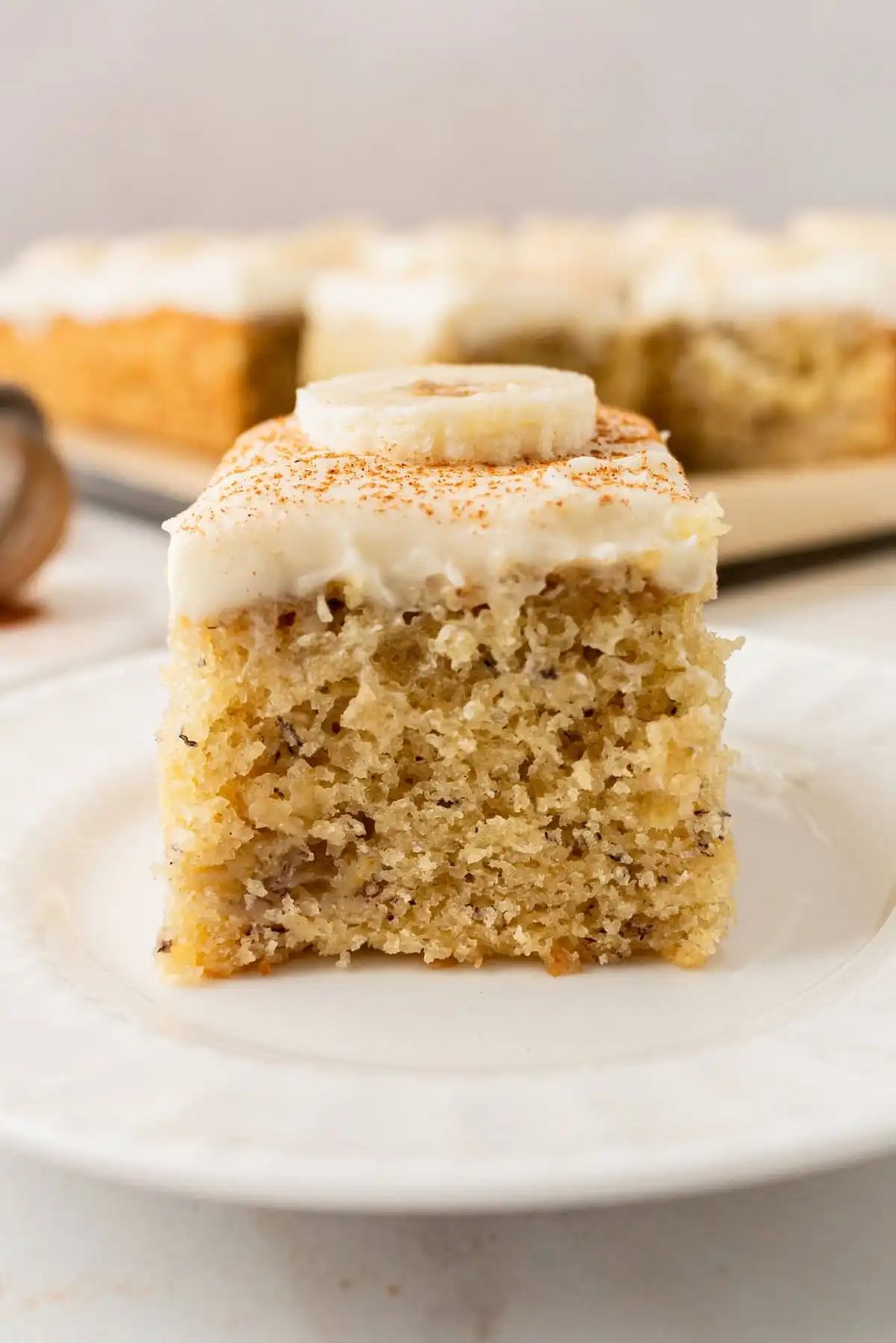 Jeff's BEST Banana Cake Recipe is a moist and tender banana cake with a creamy, sweet, and buttery cream cheese frosting. Some say it is the best banana cake in the world! This moist banana cake with cream cheese frosting is baked in a 9×13 pan and is always a hit!