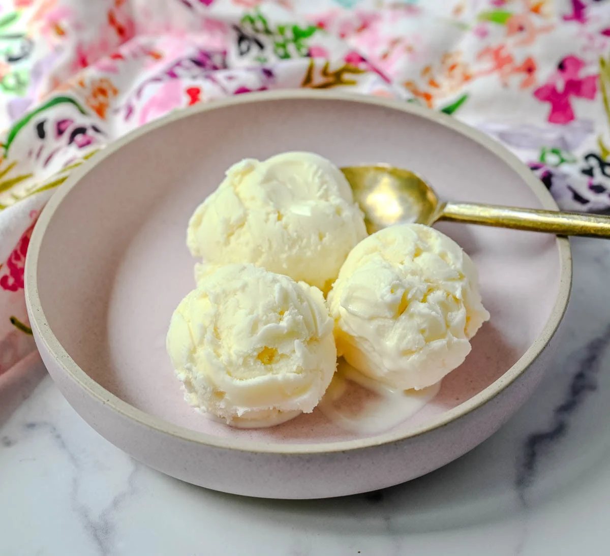 Sweet, creamy, and smooth, this copycat Jeni's Sweet Cream Ice Cream is the homemade ice cream recipe every ice cream lover needs in their life! The secret to Jeni's famously creamy and scoopable texture is a combination of cream cheese, cornstarch, and light corn syrup that prevents ice crystals from forming and keeps every single scoop silky smooth straight from the freezer. This is the ultimate homemade ice cream recipe you will make on repeat all summer long!