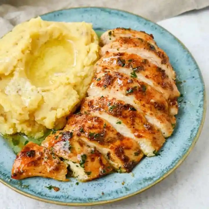 This is the easiest baked chicken recipe that is so flavorful and juicy. This homemade spice rub is perfect for oven baked chicken and makes it perfectly spiced. I am sharing my tips for making the best baked chicken.