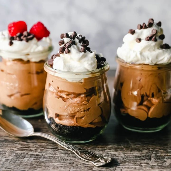 Chocolate Nutella Cheesecake Mousse No-Bake 5-Minute Chocolate Nutella Mousse made with only four ingredients -- Nutella, cream cheese, heavy cream, and powdered sugar. www.modernhoney.com #mousse #chocolatemousse #dessert
