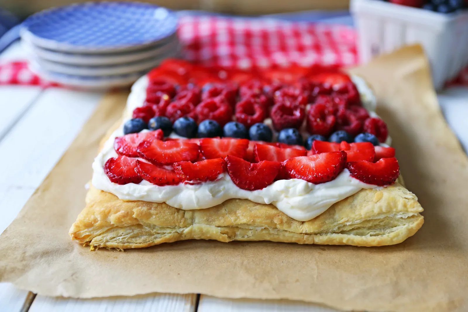 Lemon Berry Cheesecake Puff Pastry Baked Puff Pastry topped with Lemon Cheesecake Filling and Fresh Berries. An easy, beautiful, festive summer dessert. www.modernhoney.com