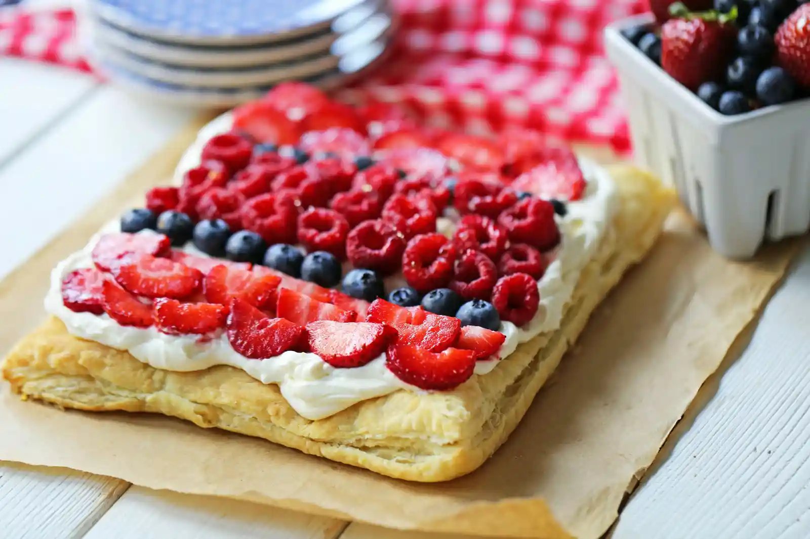 Lemon Berry Cheesecake Puff Pastry Baked Puff Pastry topped with Lemon Cheesecake Filling and Fresh Berries. An easy, beautiful, festive summer dessert. www.modernhoney.com
