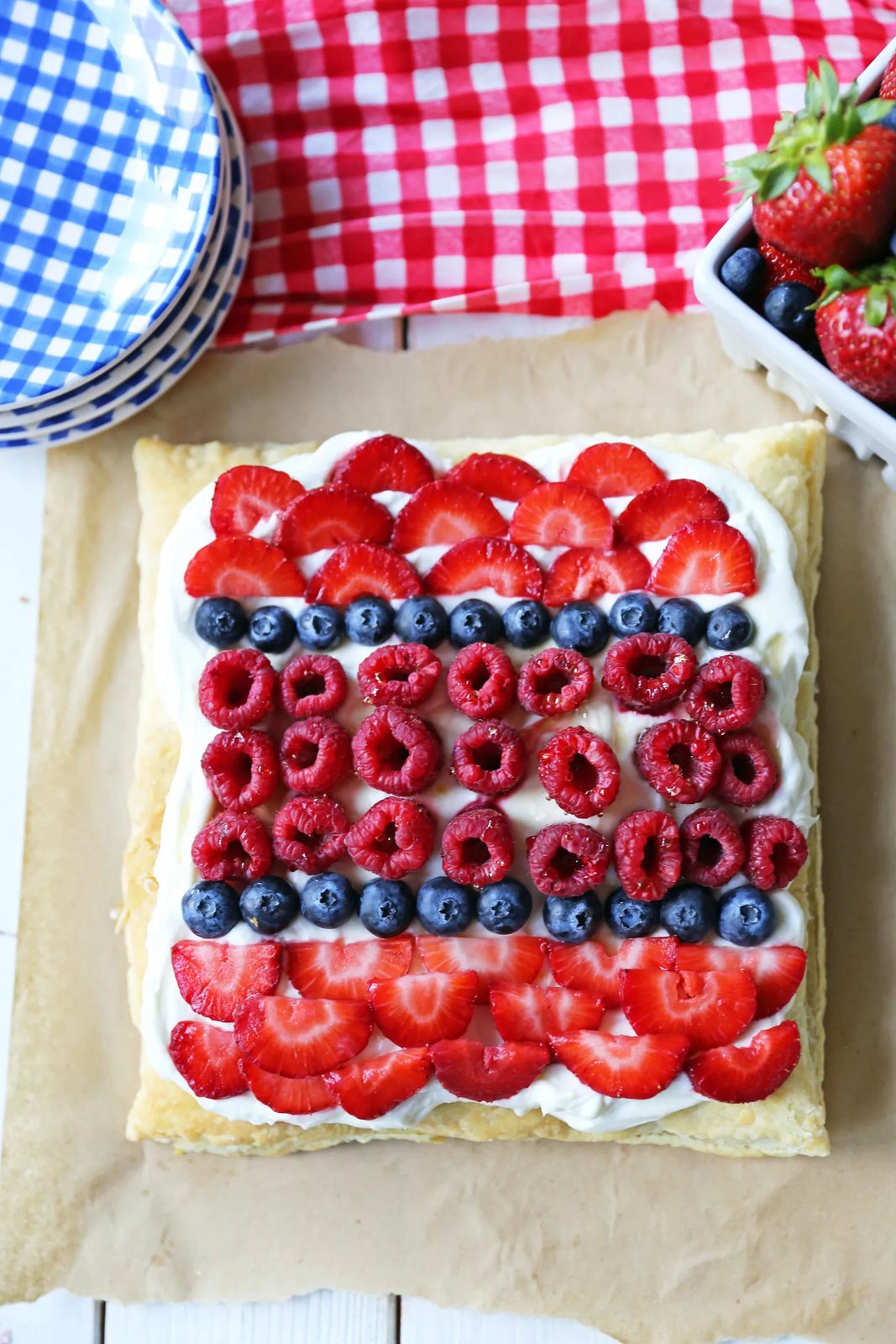 Lemon Berry Cheesecake Puff Pastry Baked Puff Pastry topped with Lemon Cheesecake Filling and Fresh Berries. An easy, beautiful, festive summer dessert. www.modernhoney.com