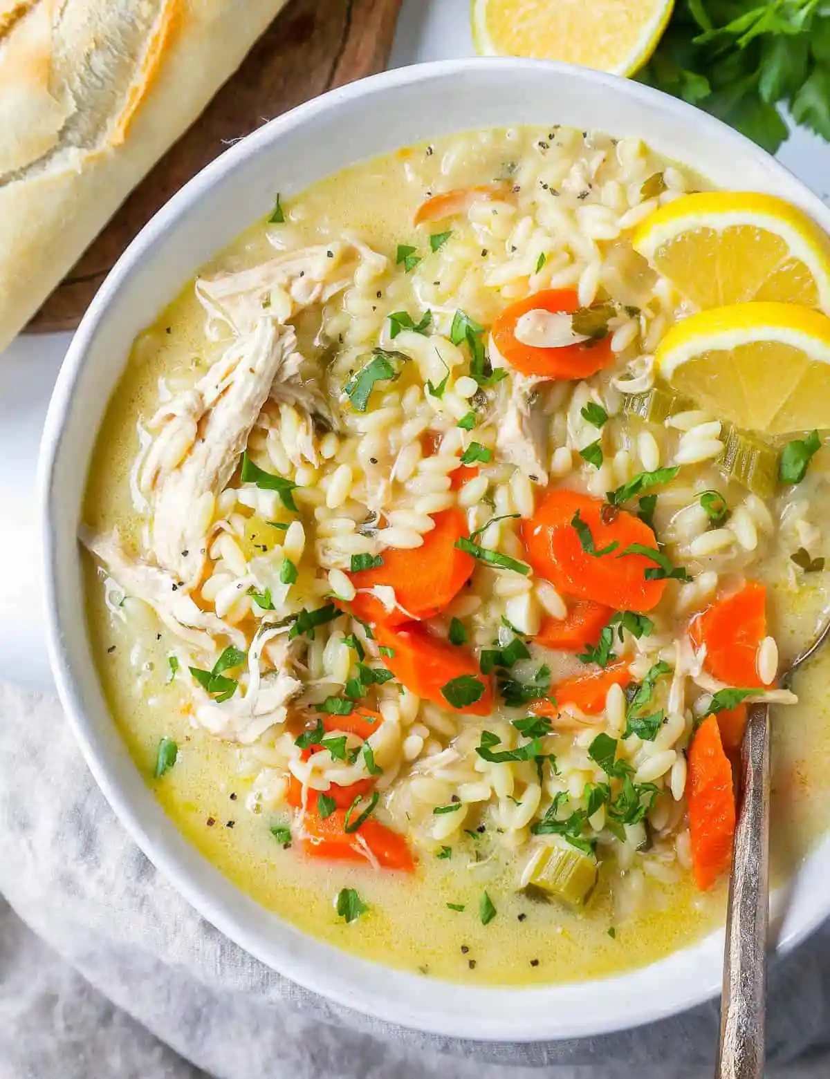 This is the best Lemon Chicken Orzo Soup recipe! This Chicken Orzo Soup is made with tender chicken with onions, carrots, celery, and garlic in a fresh lemon cream broth with fresh parmesan cheese. You will love this lemon chicken soup recipe!