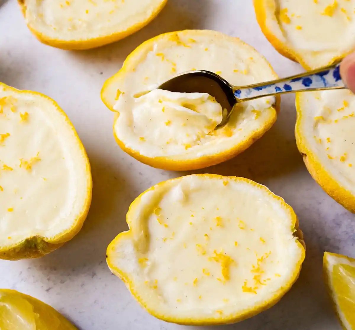 This Lemon Posset recipe is a silky, smooth, lemon custard that is so simple yet elegant and the perfect quick and easy lemon dessert. This bright and creamy lemon dessert is served in fresh lemons for a luxurious dessert.