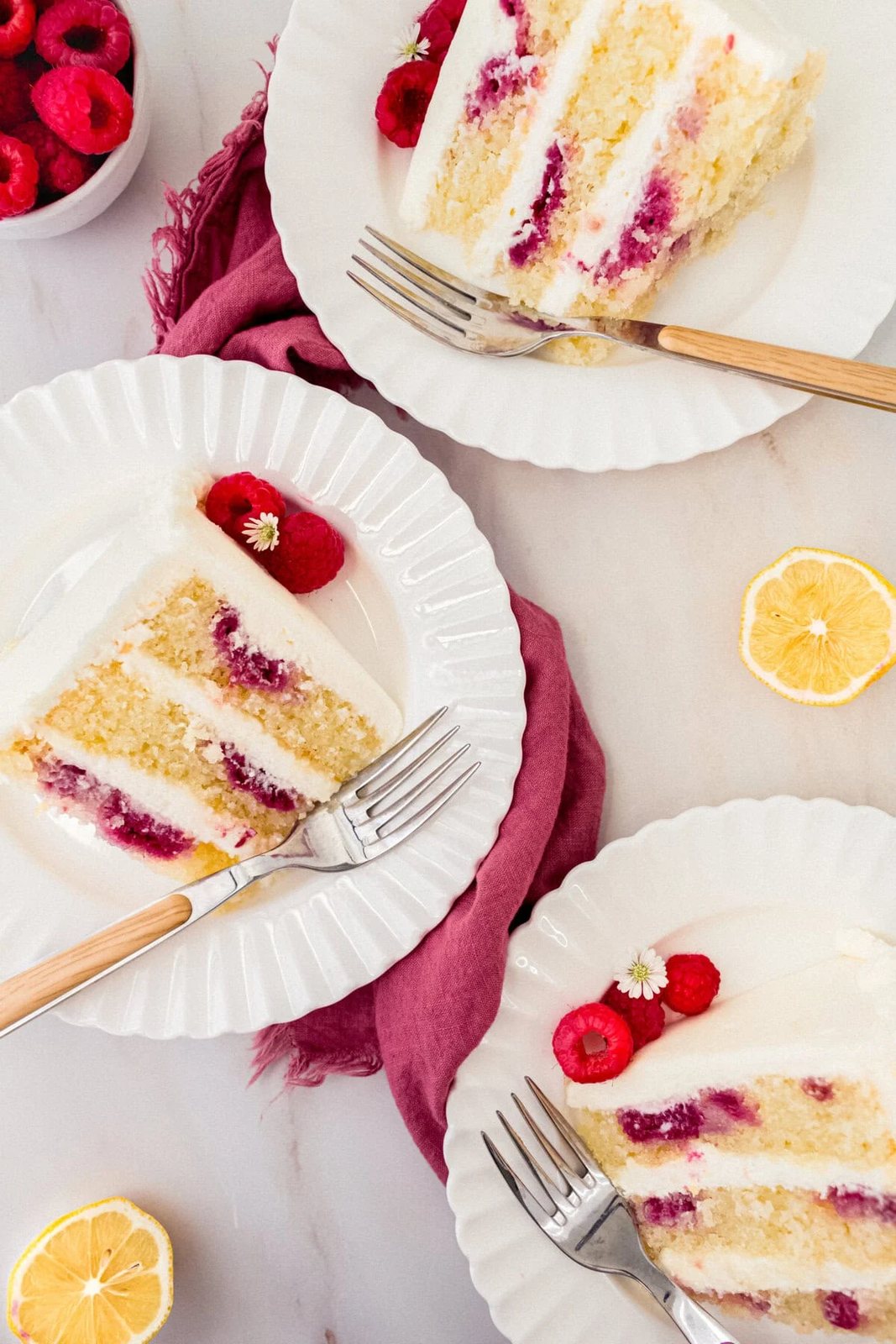 Lemon Raspberry Cake with Lemon Cream Cheese Frosting. A light and fluffy lemon cake with fresh raspberries and a fresh lemon cream cheese frosting. A sweet and tangy lemon berry cake!