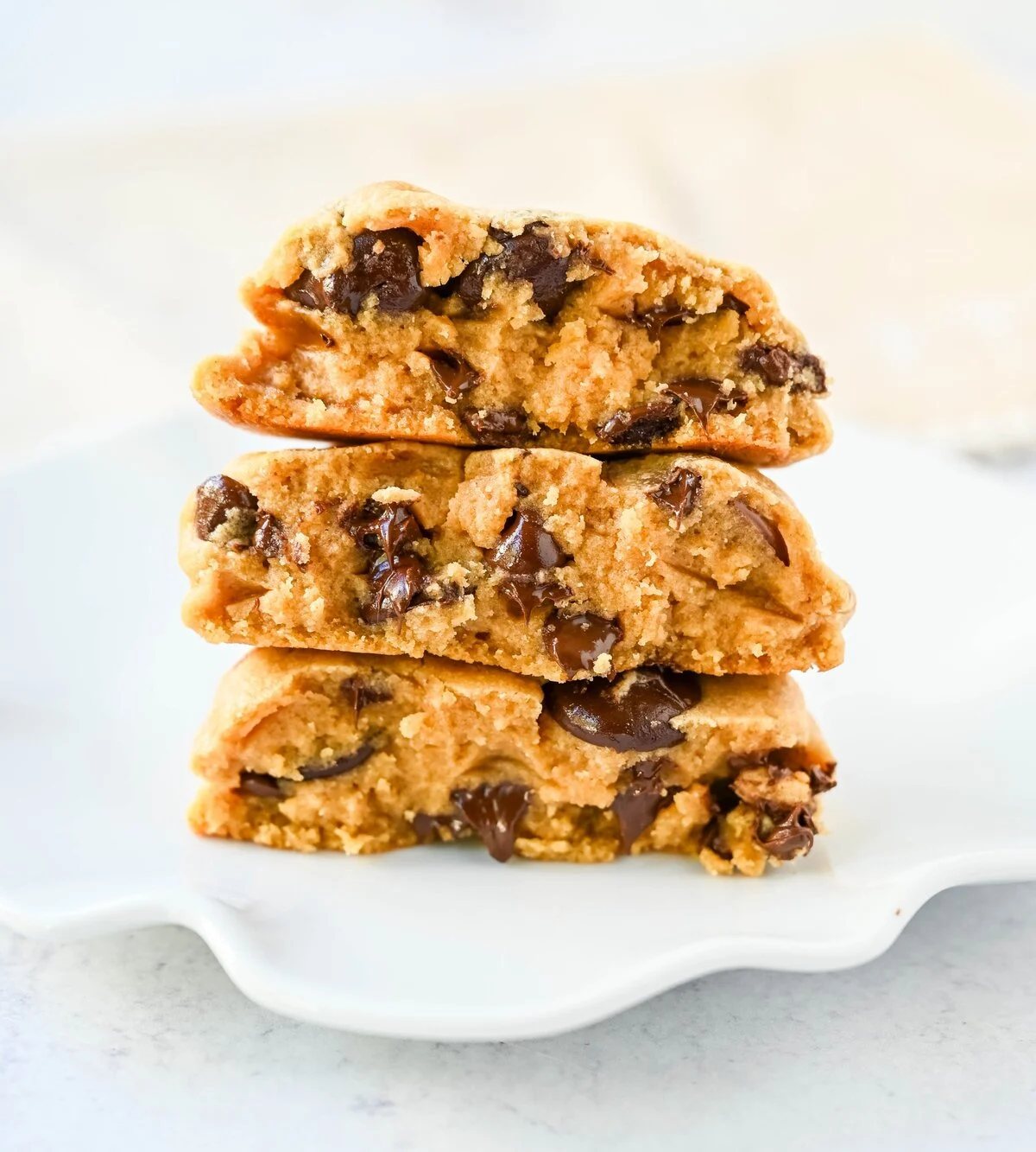 Rich, thick, and soft, these peanut butter chocolate chip cookies taste just like Levain Bakery but made at home. These Levain Bakery Peanut Butter Dark Chocolate Chip cookies are the perfect soft peanut butter chocolate chunk cookie!
