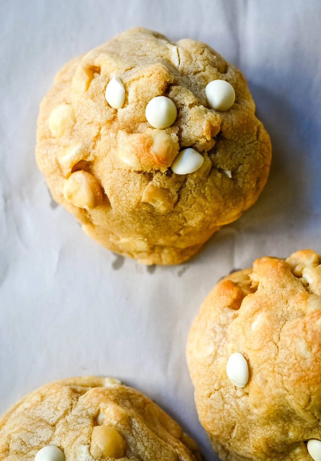 Soft in the center and crisp on the edges, these Levain Bakery White Chocolate Macadamia Cookies taste straight out of the bakery. This White Chocolate Macadamia Nut cookie recipe creates thick, buttery cookies loaded with creamy white chocolate chips and toasted macadamia nuts.