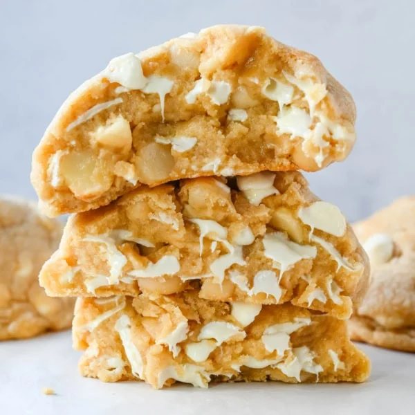 Soft in the center and crisp on the edges, these Levain Bakery White Chocolate Macadamia Cookies taste straight out of the bakery. This White Chocolate Macadamia Nut cookie recipe creates thick, buttery cookies loaded with creamy white chocolate chips and toasted macadamia nuts.