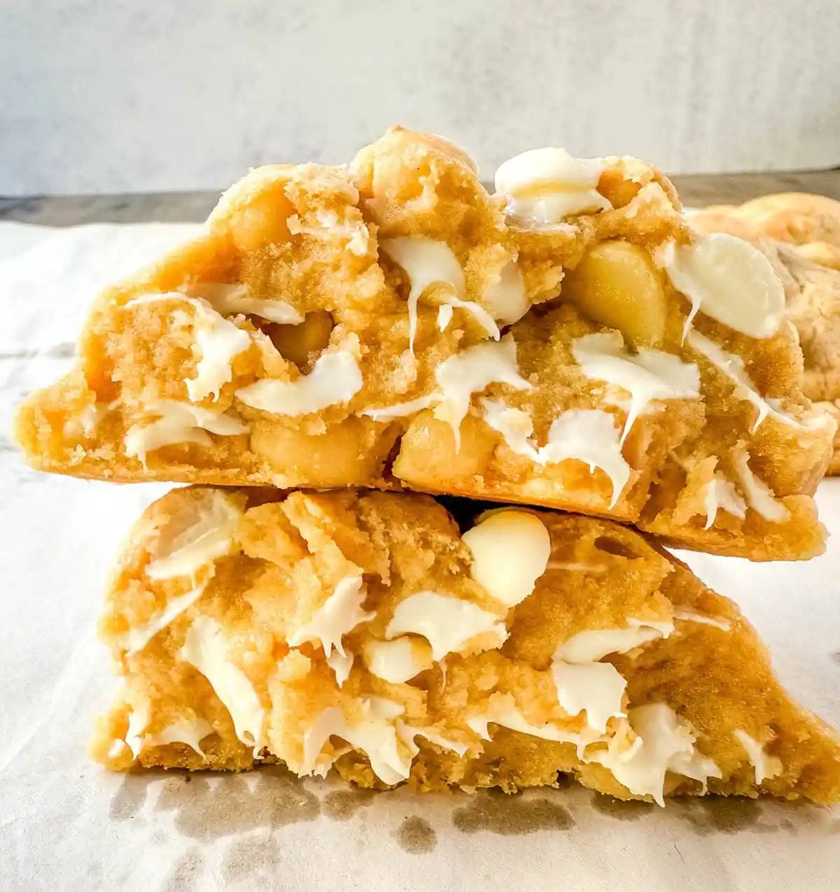 Soft in the center and crisp on the edges, these Levain Bakery White Chocolate Macadamia Cookies taste straight out of the bakery. This White Chocolate Macadamia Nut cookie recipe creates thick, buttery cookies loaded with creamy white chocolate chips and toasted macadamia nuts.