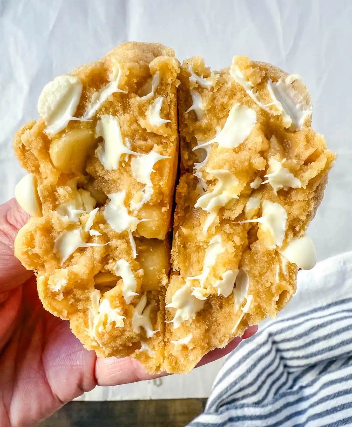 Soft in the center and crisp on the edges, these Levain Bakery White Chocolate Macadamia Cookies taste straight out of the bakery. This White Chocolate Macadamia Nut cookie recipe creates thick, buttery cookies loaded with creamy white chocolate chips and toasted macadamia nuts.