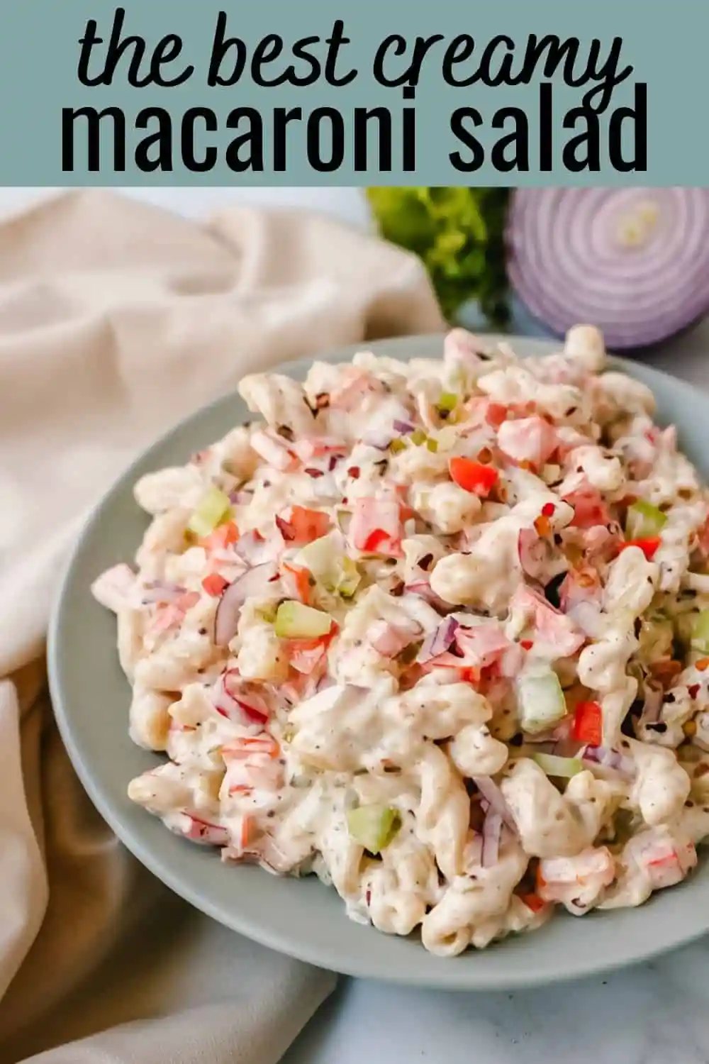 The best creamy macaroni salad recipe made with pasta, vegetables, and a creamy homemade sweet and tangy dressing. An easy, traditional macaroni salad recipe!