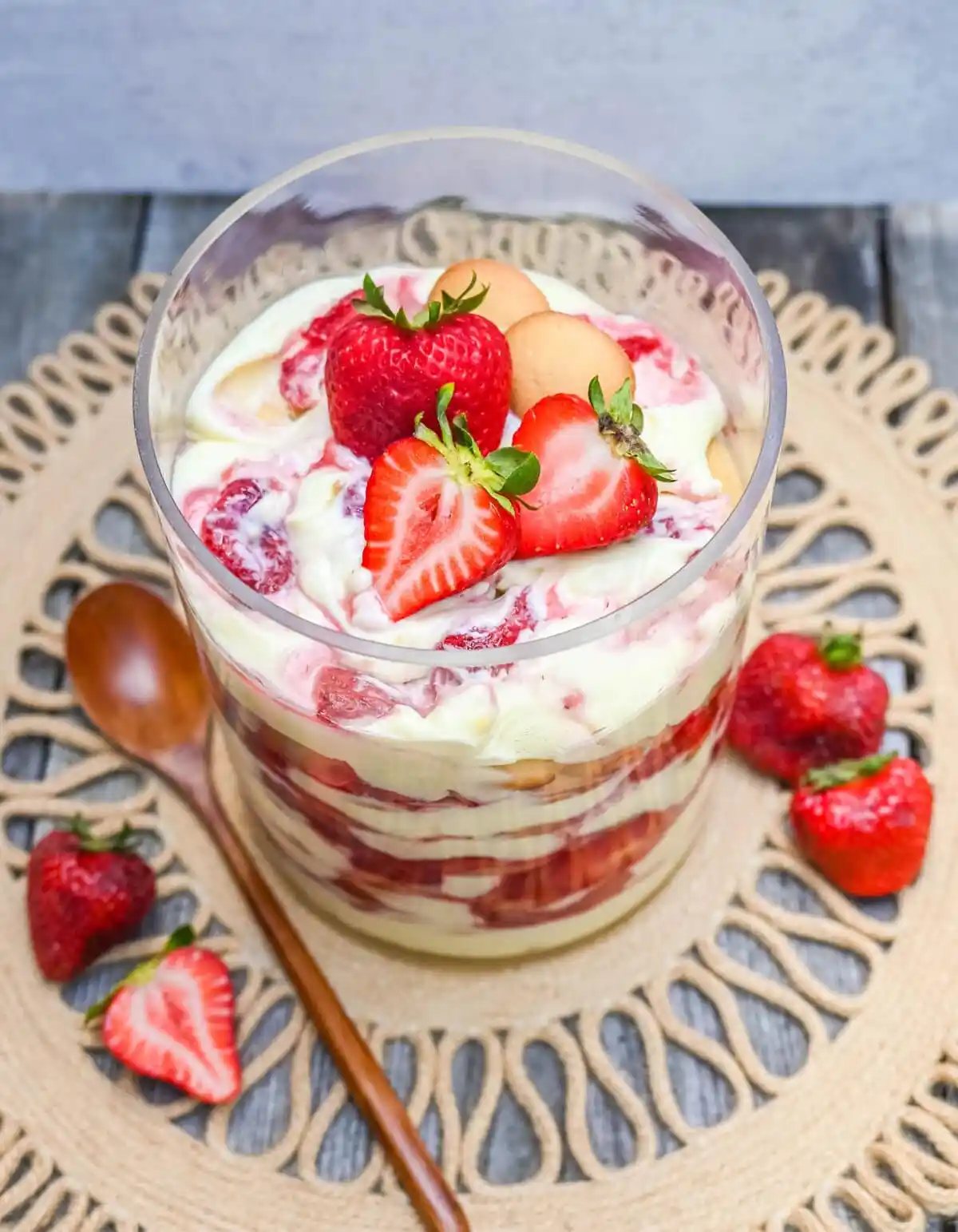 This Magnolia Bakery Strawberry Shortcake Pudding is such a quintessential summer dessert. It is made with fresh or roasted strawberries in a creamy vanilla pudding and whipped cream with Nilla wafers. This Strawberry Shortcake Pudding will be your favorite no-bake summer dessert recipe. This strawberry trifle will be a hit!