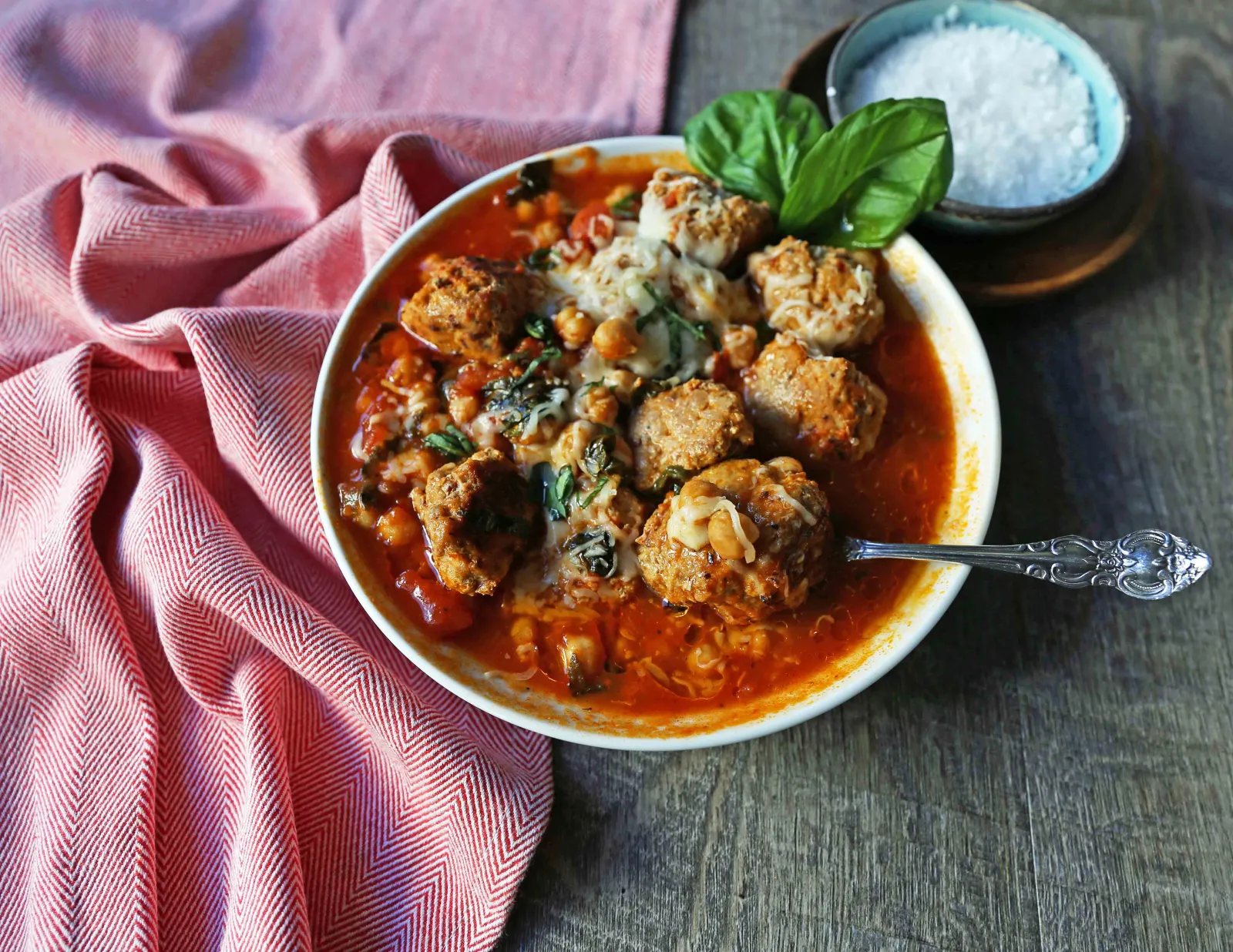 Healthy Spicy Turkey Meatball Soup A healthy soup made with lean turkey meatballs, spinach, chickpeas, marinara sauce, and parmesan cheese. Gluten-Free Turkey Meatball Soup. Low-carb soup recipe. www.modernhoney.com #turkeymeatballsoup #lowcarb #glutenfree #turkeymeatball