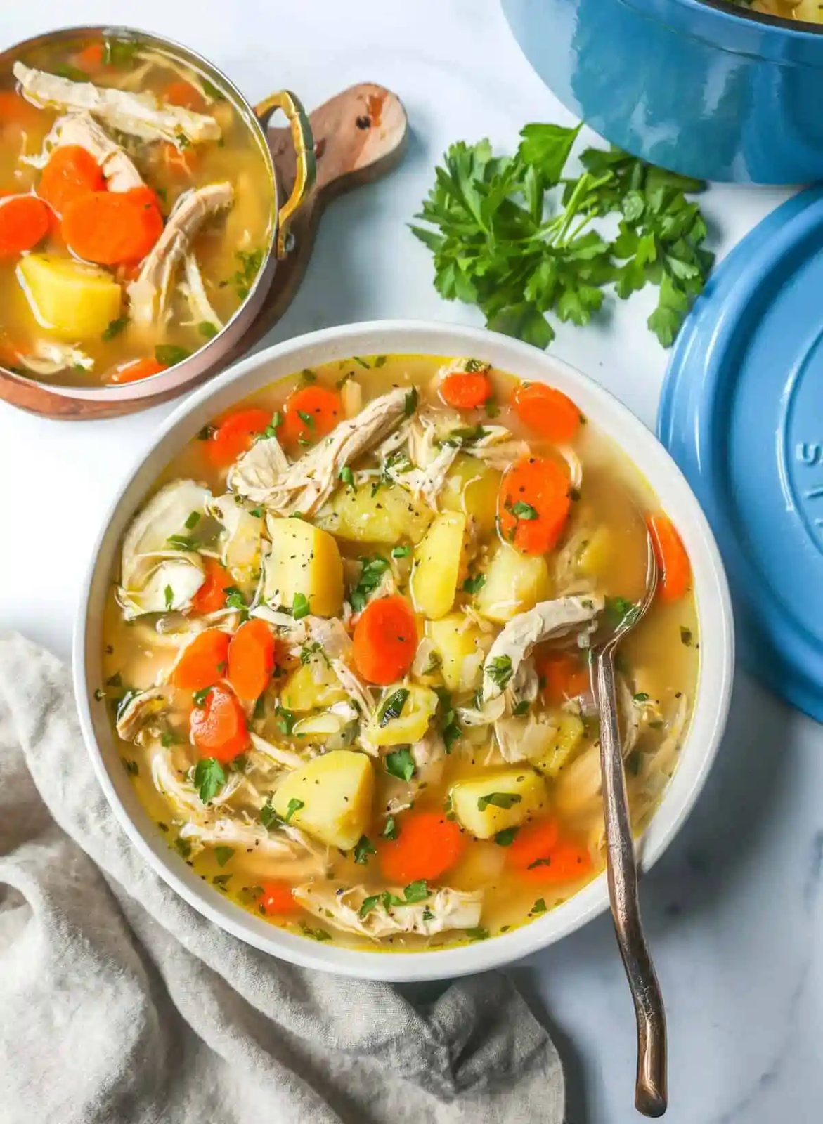 This Homemade Chicken Soup is made with tender chicken, carrots, onion, potatoes, fresh herbs, and seasonings all in a warm chicken broth. This is the perfect chicken soup on a cold winter's day.
