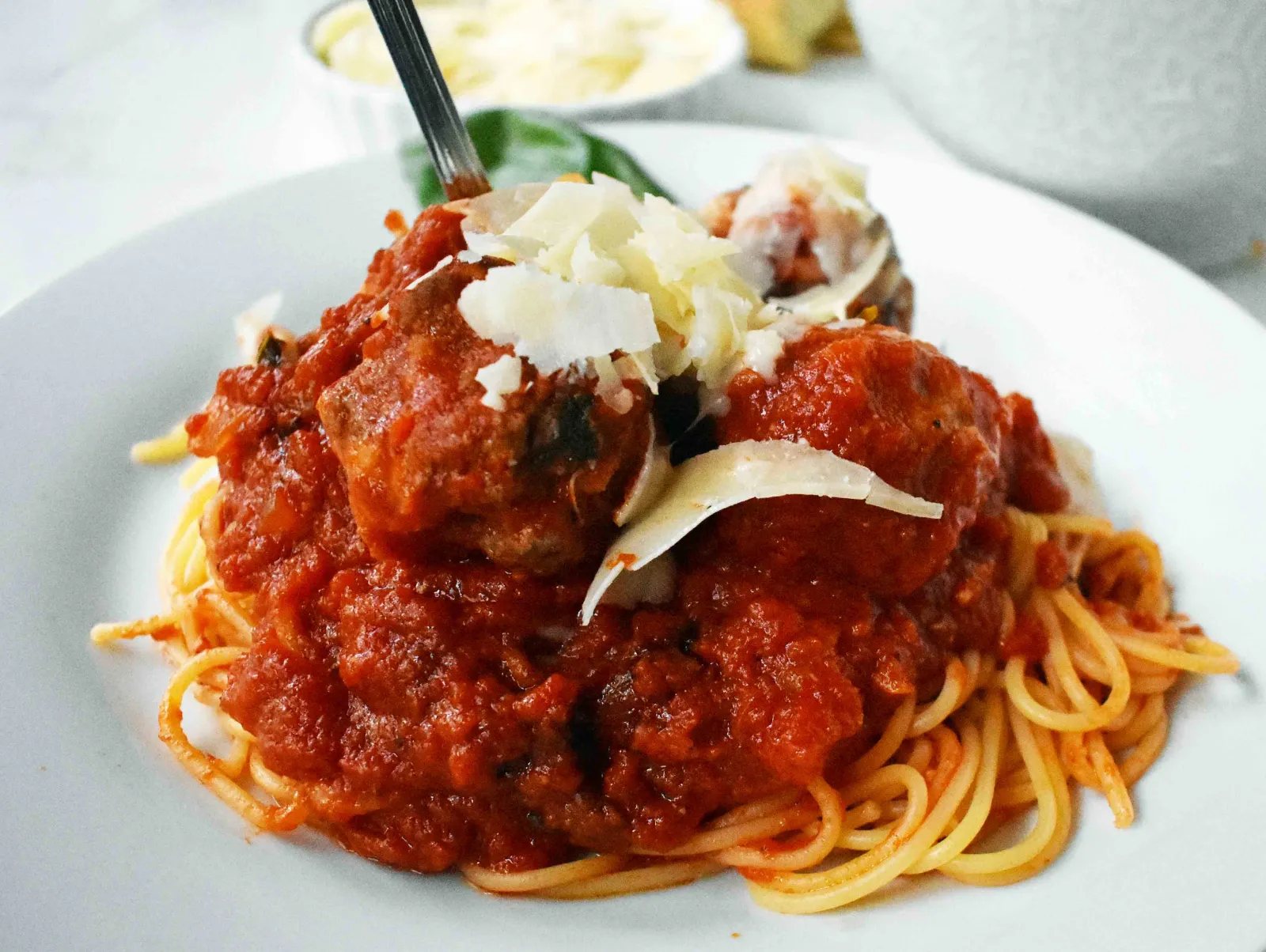 Mama's Best Ever Spaghetti and Meatballs by Modern Honey. Homemade meatballs made from scratch. Authentic Italian meatballs and marinara sauce.