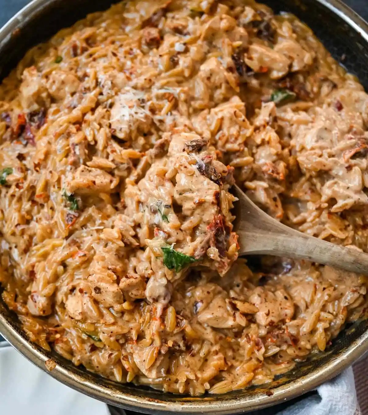 This Marry Me Chicken Orzo is a creamy, one-pan dinner made with tender chicken, sun-dried tomatoes, parmesan, and perfectly cooked orzo pasta. Inspired by the viral “marry me chicken” recipe, this version adds orzo to soak up the rich garlic cream sauce for an easy comfort meal.