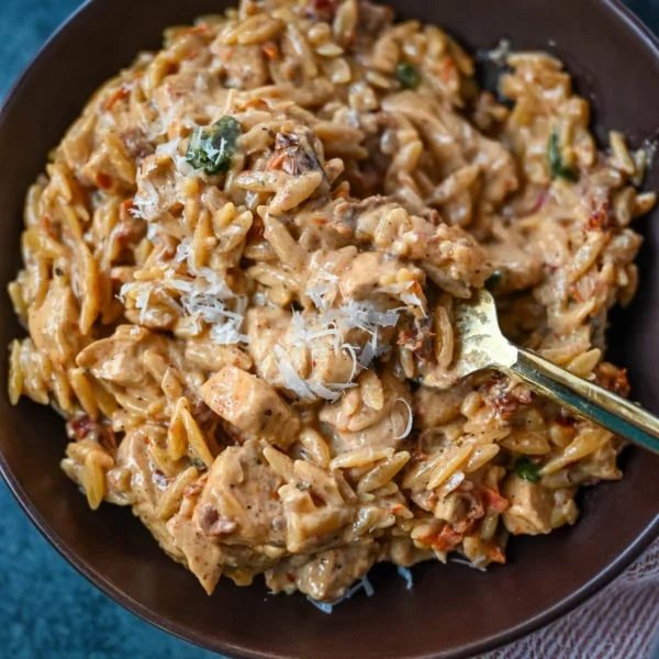 This Marry Me Chicken Orzo is a creamy, one-pan dinner made with tender chicken, sun-dried tomatoes, parmesan, and perfectly cooked orzo pasta. Inspired by the viral “marry me chicken” recipe, this version adds orzo to soak up the rich garlic cream sauce for an easy comfort meal.