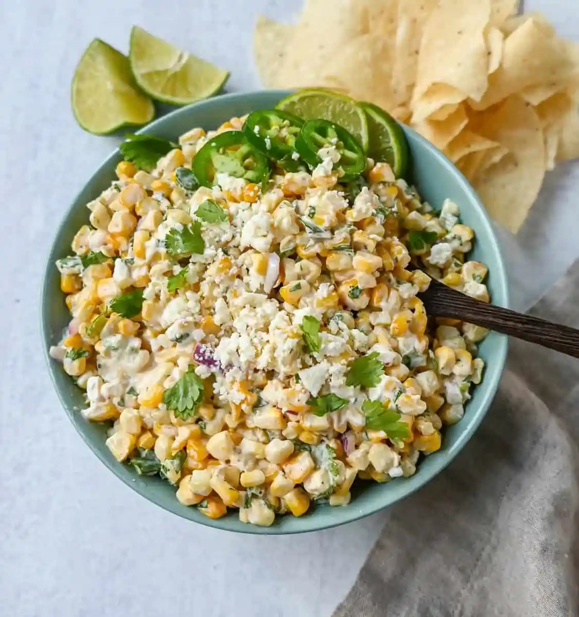 Inspired by Mexican street corn, this dip is made with sweet roasted corn and mixed with red onion, cilantro, jalapeño, lime juice, mexican spices, a touch of mayo, and cotija cheese.