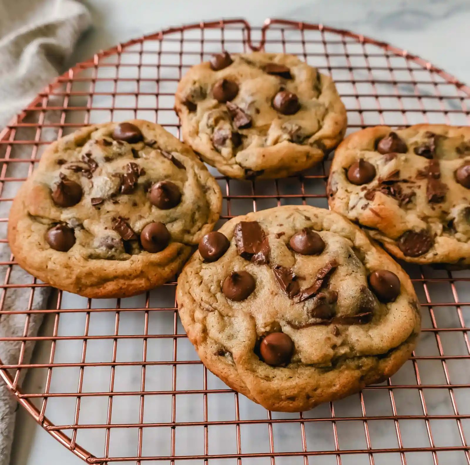 Thick, chewy milk chocolate chip cookies have the perfect chewy centers with a lot of melted chocolate and slightly crispy edges. The best milk chocolate chip cookie recipe!