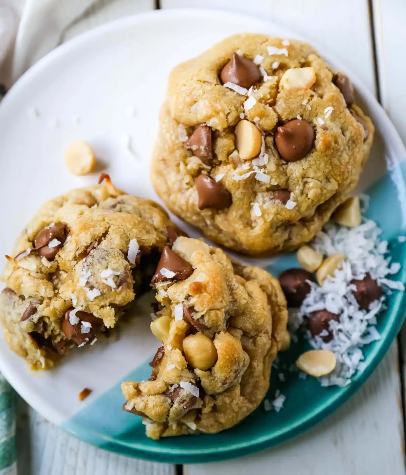 Milk Chocolate Chip Macadamia Nut Coconut Cookies Thick soft and chewy bakery-style milk chocolate chip macadamia nut coconut cookies are an Island favorite! www.modernhoney.com #cookies #chocolatechipmacadamianut