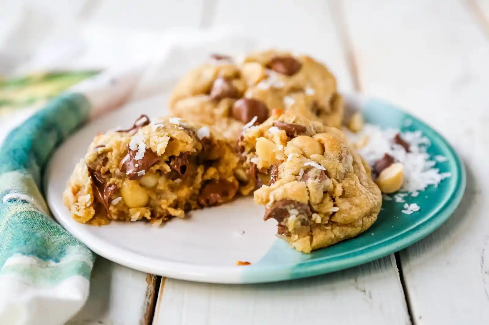 Milk Chocolate Chip Macadamia Nut Coconut Cookies Thick soft and chewy bakery-style milk chocolate chip macadamia nut coconut cookies are an Island favorite! www.modernhoney.com #cookies #chocolatechipmacadamianut