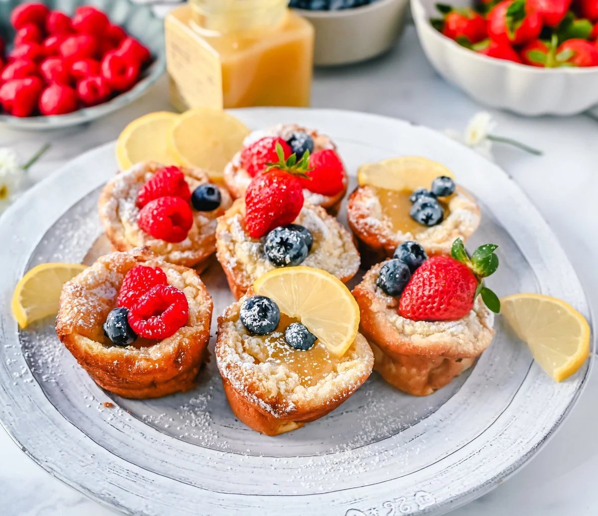 Mini Dutch Baby Pancakes (in a muffin tin). These mini, bite-size Dutch Baby pancakes are made the same way as traditional German pancakes but these are baked in muffin tins. These easy, golden and buttery mini puffed pancakes are perfect to serve to family and friends.
