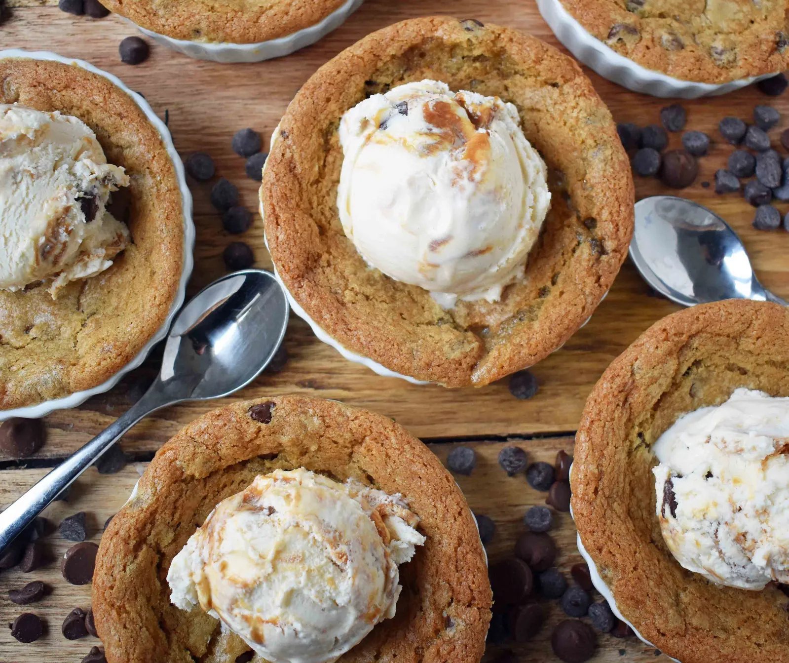 Chocolate Chip Mini Individual Pizookies. Homemade mini chocolate chip pizookie in ramekins baked until golden and topped with vanilla ice cream. www.modernhoney.com