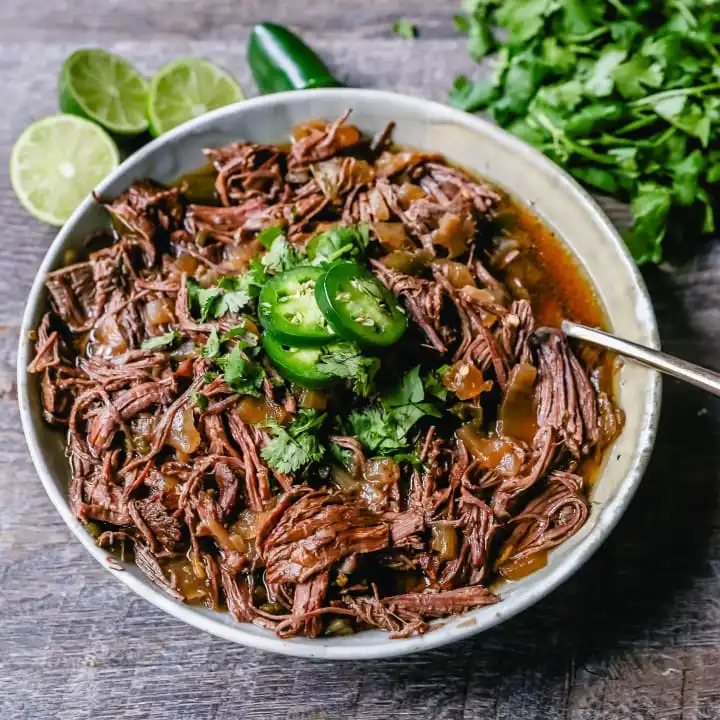 Slow Cooker Barbacoa Beef Tender, flavorful, slow-cooked beef with onions, jalapenos, and spices make this the perfect barbacoa beef for burritos, tacos, enchiladas, quesadillas, on a salad, or just on its own with a few side dishes.