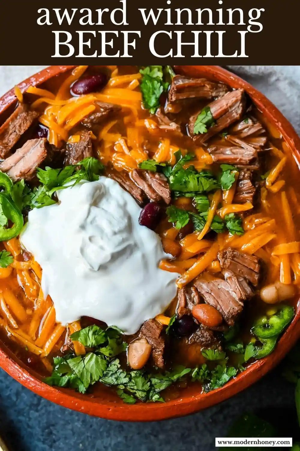 This bold and flavorful beef chili recipe combines tender, bite-sized cubes of chuck roast with a blend of beans, spices, and a can of Dr. Pepper (or Coke) to help tenderize the meat and add a touch of sweetness. The combination of chili powder, cumin, and cayenne pepper gives the chili a rich, smoky heat, while the fire-roasted tomatoes and beef broth create a hearty base. Perfect for a cozy meal or a game day feast, this chili is easily customizable with your favorite toppings like cheese, sour cream, or fresh jalapeños for an extra kick. The mix of pinto, kidney, and Great Northern beans adds texture and heartiness, making this dish satisfying and comforting.