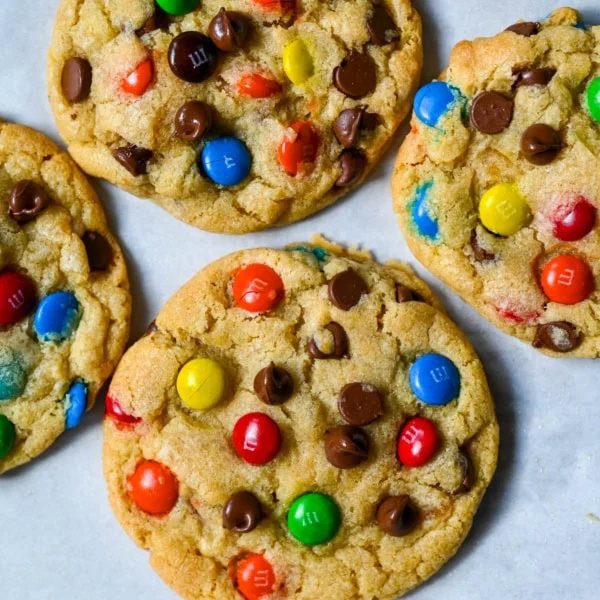 These M&M chocolate chip cookies have crisp, buttery edges and soft, chewy centers, loaded with both M&M's and semi-sweet chocolate chips. No mixer required — just mix in a bowl, chill, and bake for the best chocolate chip M&M cookies!