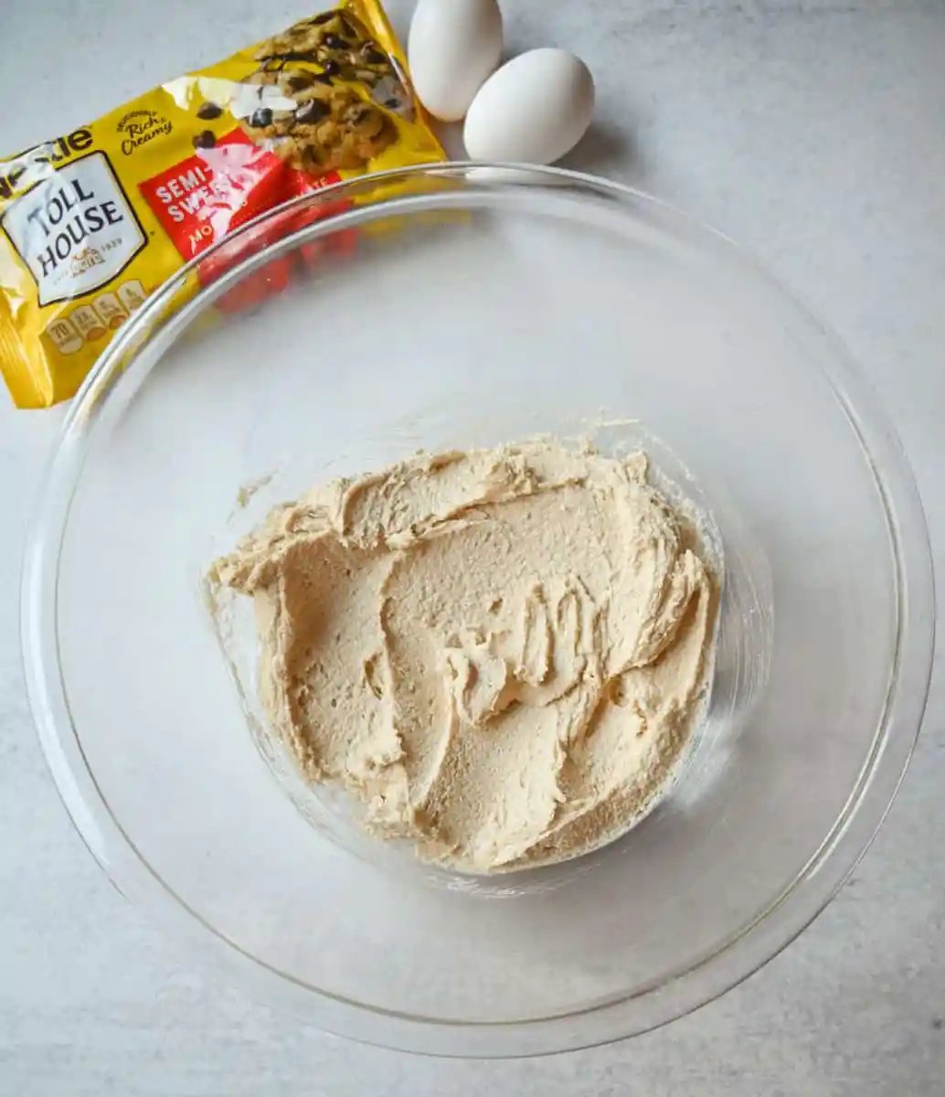 Beating together butter and sugars to make Nestle Toll House cookies