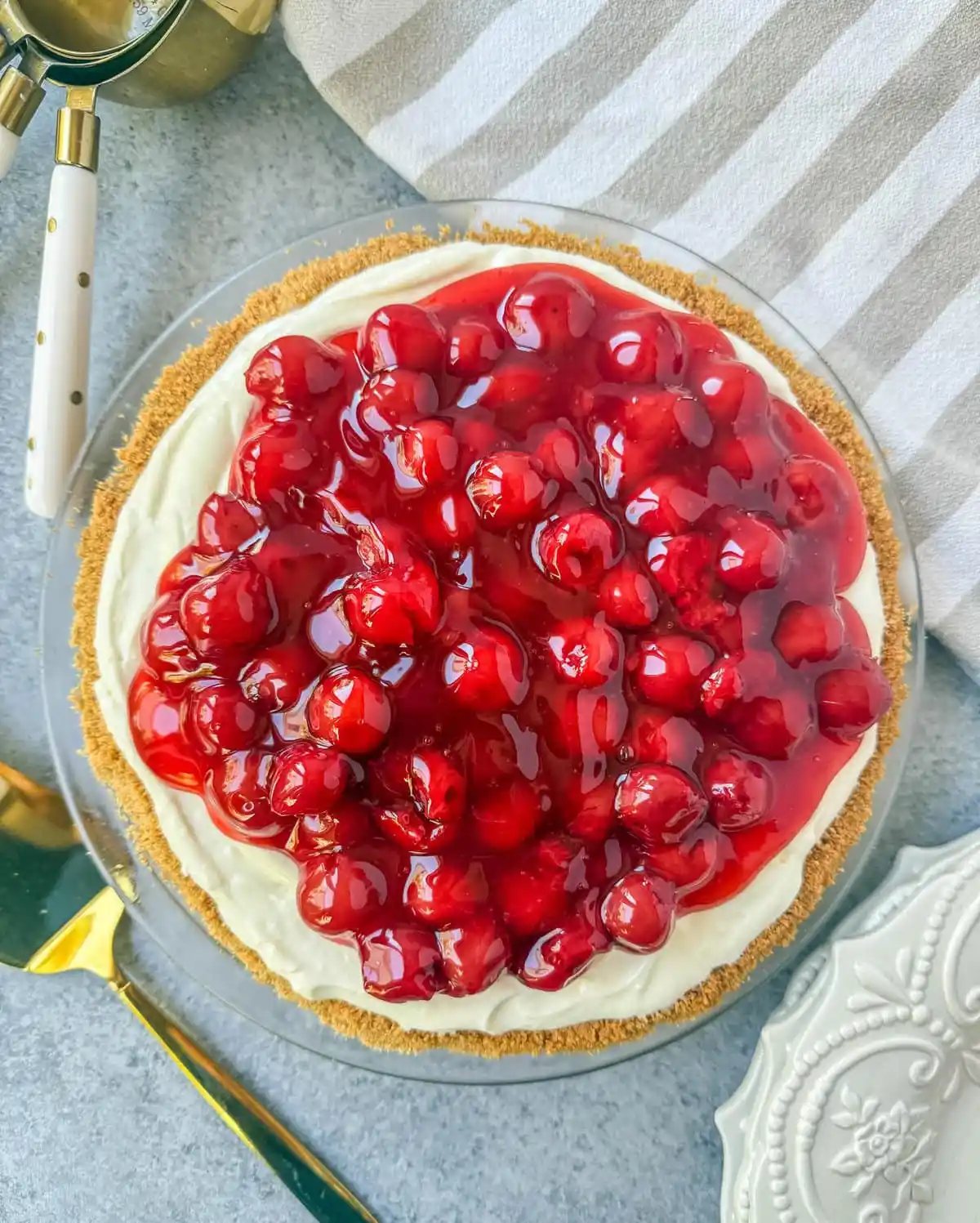 This easy No-Bake Cheesecake Recipe is made with a luscious filling made with sweetened condensed milk, cream cheese, and lemon juice, all piled onto a homemade graham cracker crust. This No Bake Cheesecake with sweetened condensed milk is perfect for when you want an effortless dessert that is easy to whip up and always a crowd pleaser.
