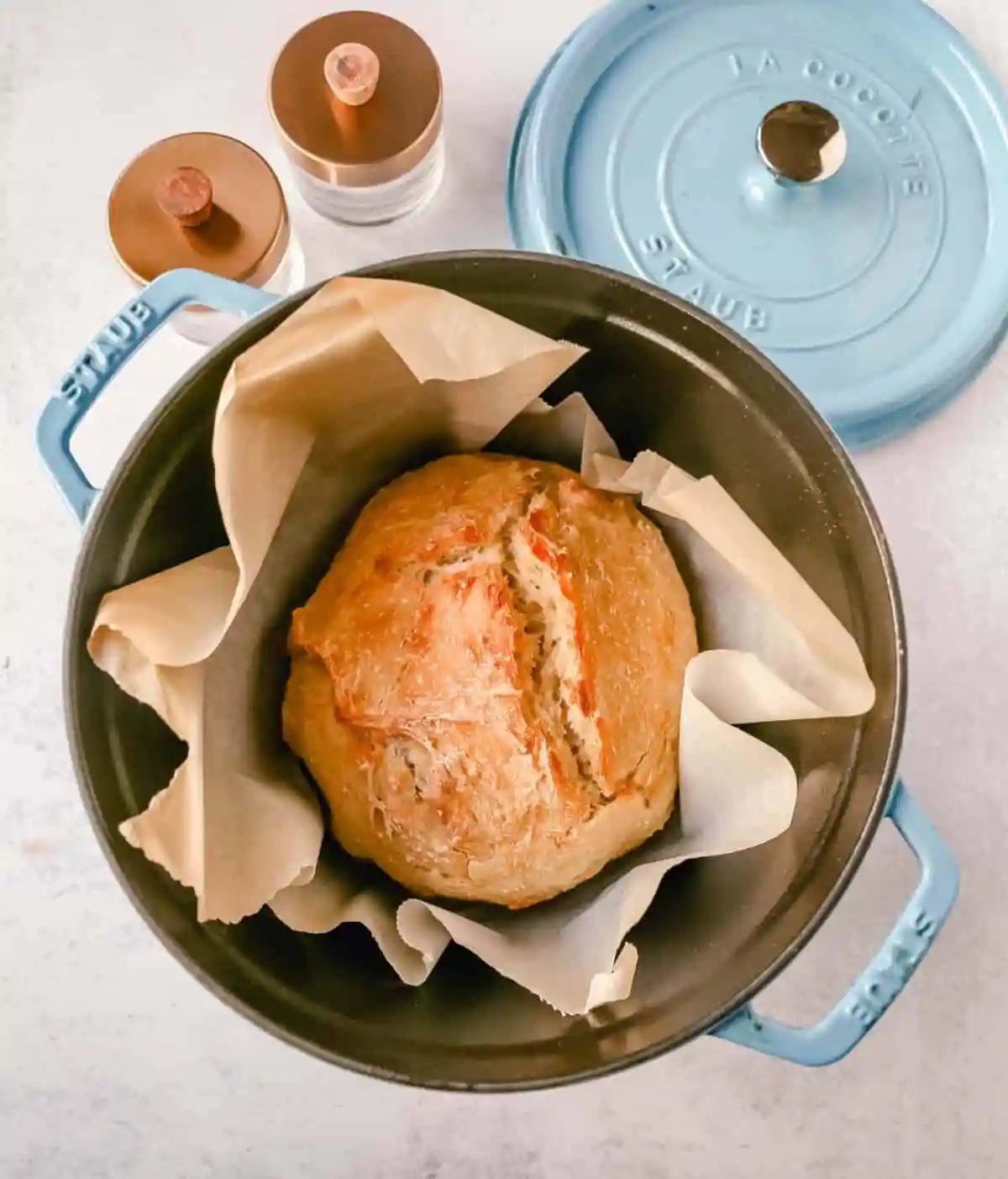 This No Knead Bread is baked in a dutch oven and is the perfect crusty french bread recipe. This makes a beautiful artisan loaf of bread and is so easy! The only ingredients you need are flour, water, salt, and yeast for the perfect overnight bread.