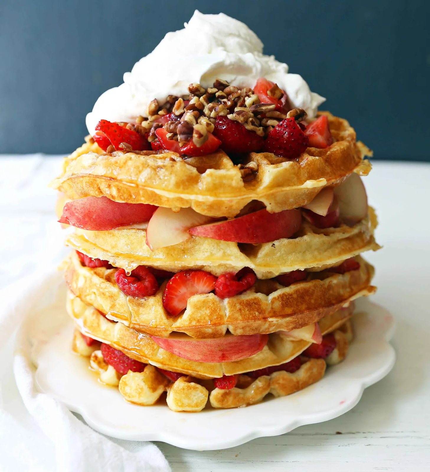 One Bowl Easy Buttermilk Waffles. Quick waffle recipe which creates chewy, crispy, and buttery waffles. The perfect waffle recipe. www.modernhoney.com #waffles #wafflerecipe #buttermilkwaffles #buttermilkwaffle