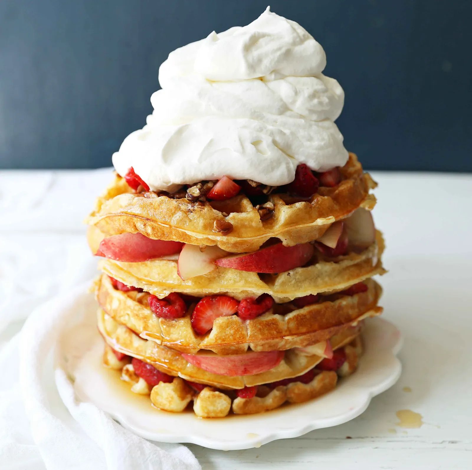 One Bowl Easy Buttermilk Waffles. Quick waffle recipe which creates chewy, crispy, and buttery waffles. The perfect waffle recipe. www.modernhoney.com #waffles #wafflerecipe #buttermilkwaffles #buttermilkwaffle