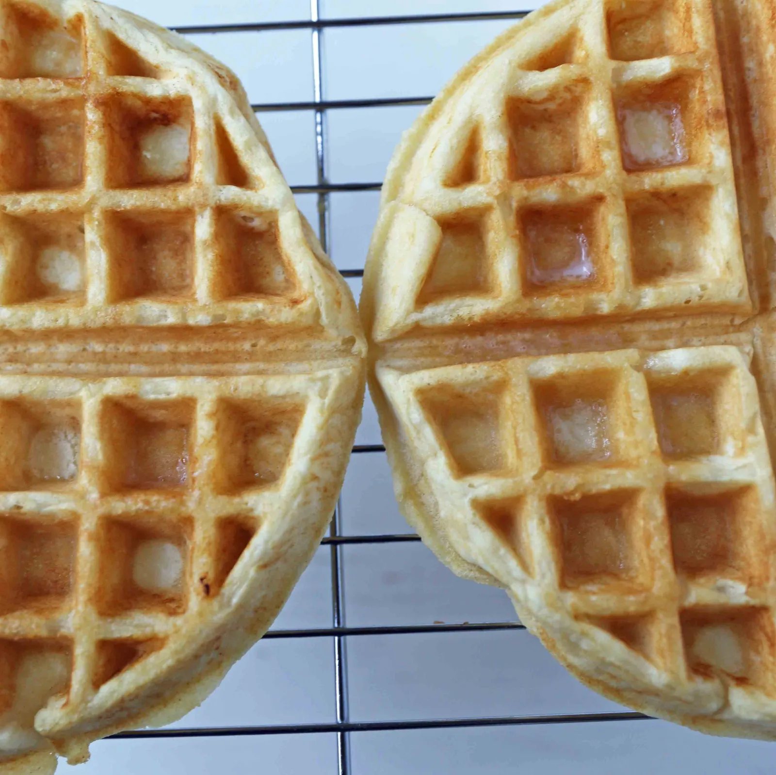 One Bowl Easy Buttermilk Waffles. Quick waffle recipe which creates chewy, crispy, and buttery waffles. The perfect waffle recipe. www.modernhoney.com #waffles #wafflerecipe #buttermilkwaffles #buttermilkwaffle