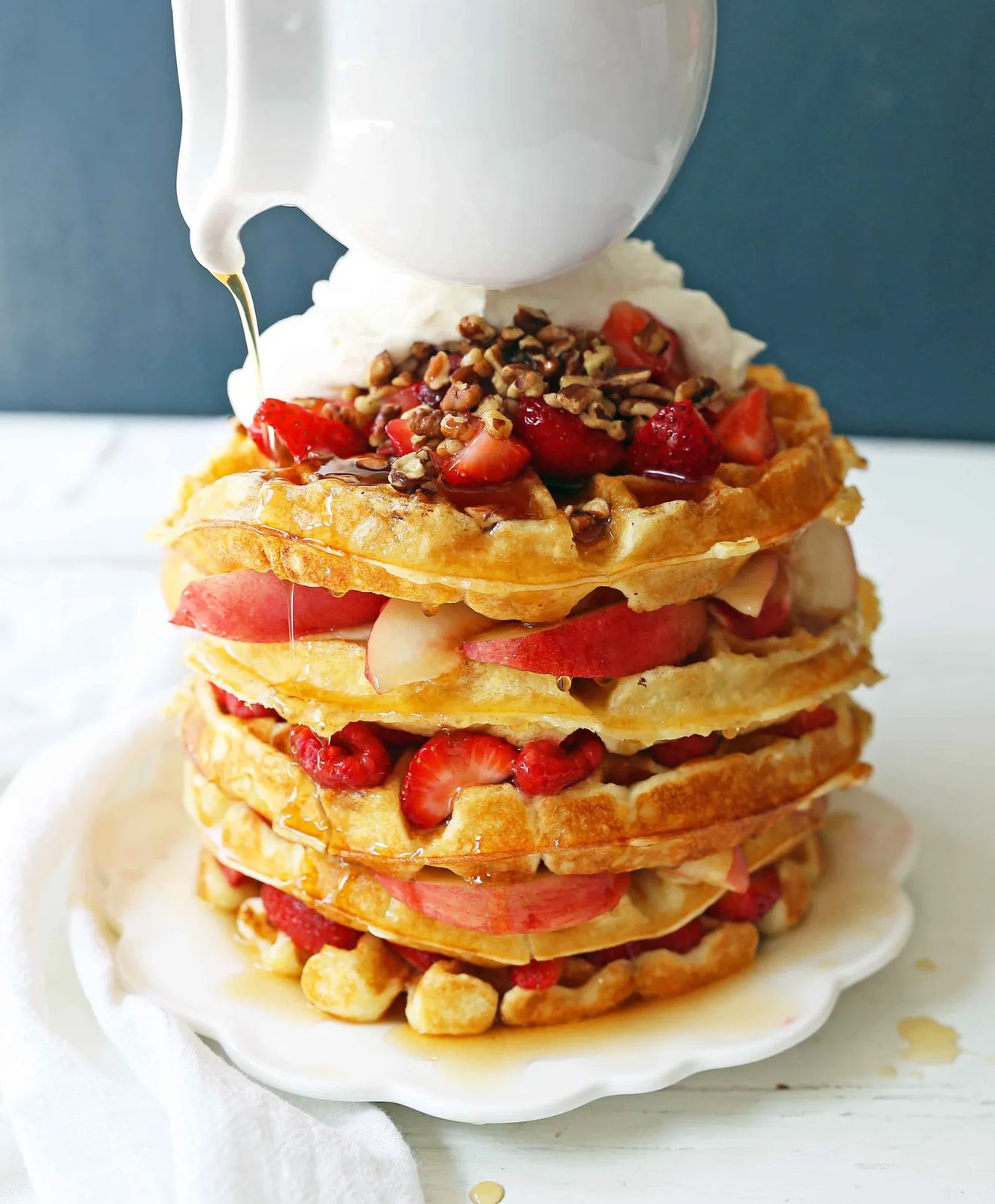 One Bowl Easy Buttermilk Waffles. Quick waffle recipe which creates chewy, crispy, and buttery waffles. The perfect waffle recipe. www.modernhoney.com #waffles #wafflerecipe #buttermilkwaffles #buttermilkwaffle