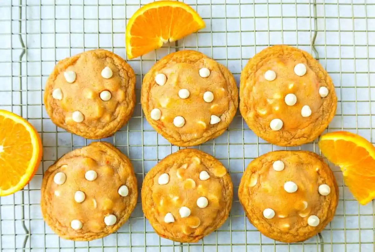 Soft and Chewy Orange Creamsicle Cookies made with fresh orange zest and juice and white chocolate chips. This Orange White Chocolate Cookie recipe is the perfect orange cookie.
